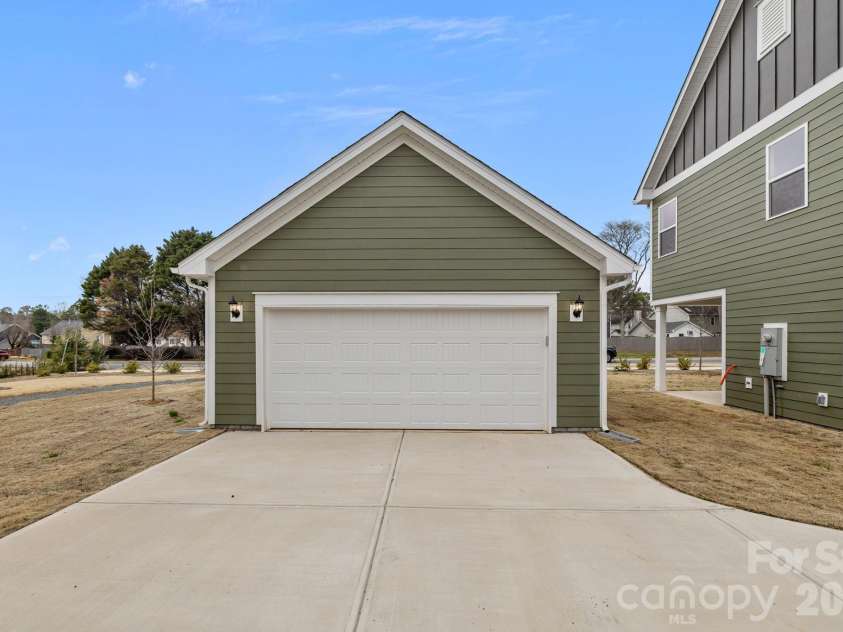 4004 Grommet Court, Matthews, NC 28105.  MLS# CAR4331659, YatesRealty ID 24733. Oversized 2 car detached garage with side door