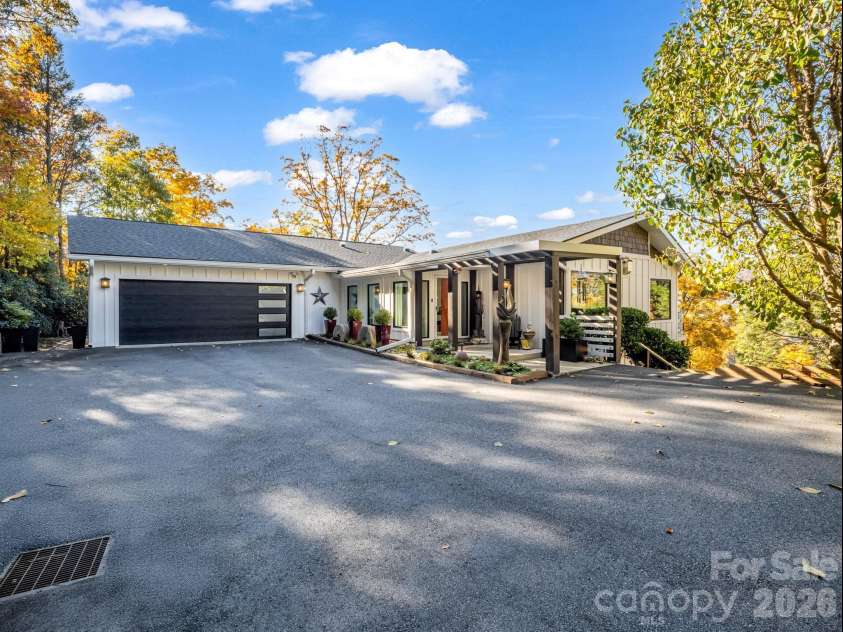 200 Piney Mountain Road, Tryon, NC 28782.  MLS# CAR4340345, YatesRealty ID 24734. Fully Renovated Mountaintop Retreat