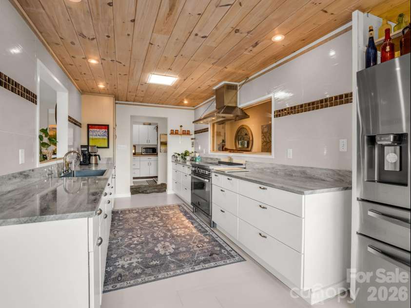 200 Piney Mountain Road, Tryon, NC 28782.  MLS# CAR4340345, YatesRealty ID 24734. Galley Kitchen