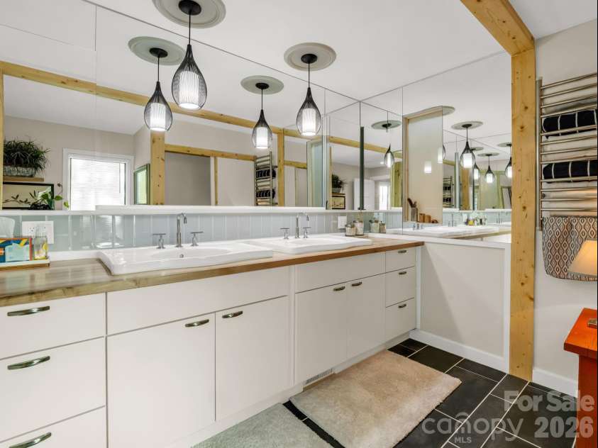 200 Piney Mountain Road, Tryon, NC 28782.  MLS# CAR4340345, YatesRealty ID 24734. Primary Bath Dual Vanities