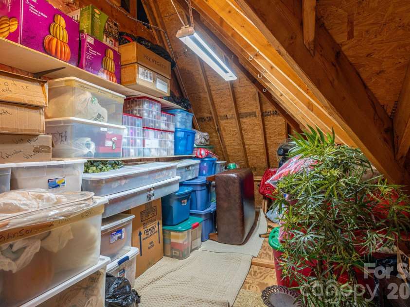 169 Cape Cod Way, Mooresville, NC 28117.  MLS# CAR4358747, YatesRealty ID 24736. 1 of 3 walk-in attic storage areas