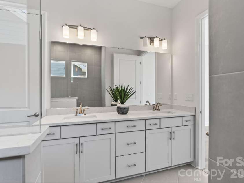 1127 Meander Lane, Waxhaw, NC 28173.  MLS# CAR4361011, YatesRealty ID 24737. Primary Bathroom Vanities