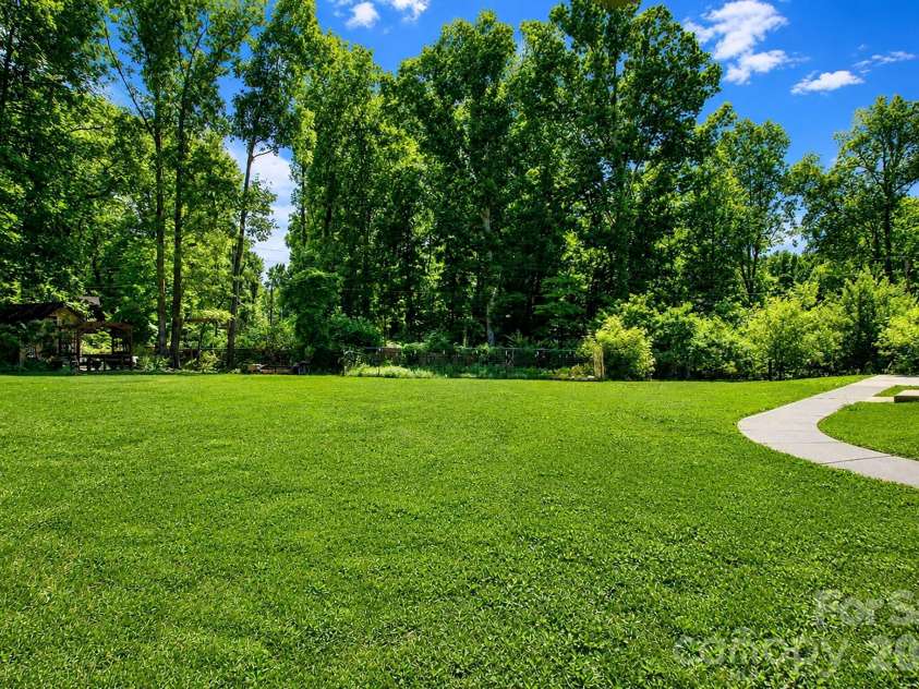 7304 River Valley Court, Mint Hill, NC 28227.  MLS# CAR4379880, YatesRealty ID 24743. Huge backyard