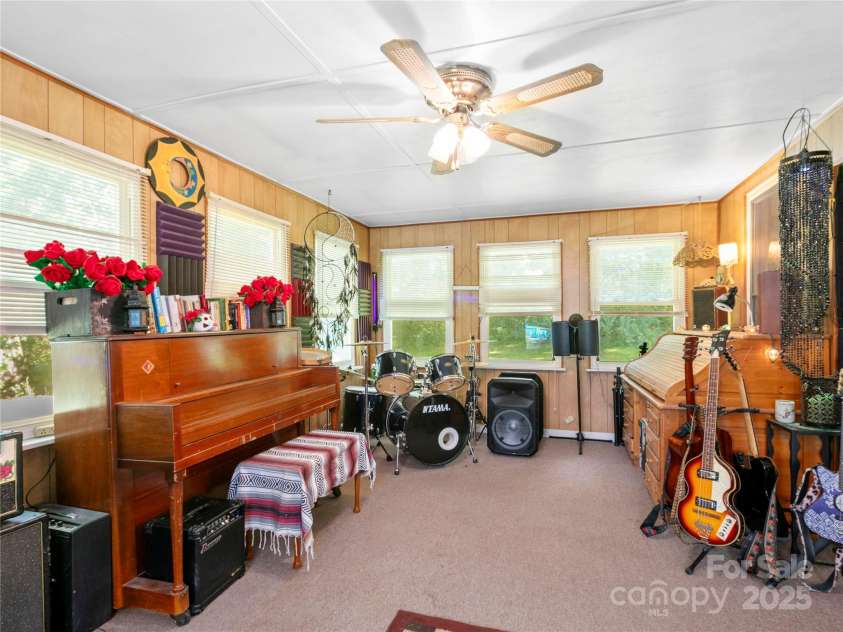 119 John Lee Montgomery Drive, Hendersonville, NC 28792.  MLS# CAR4277677, YatesRealty ID 24744. Plenty of sunlight and Windows in the sun room