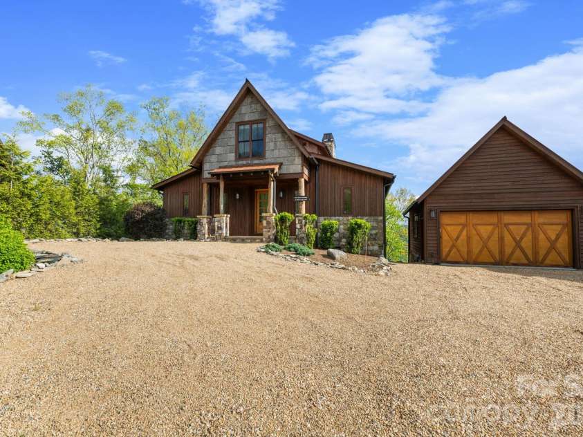 92 White Eagle Trail, Banner Elk, NC 28604.  MLS# CAR4381259, YatesRealty ID 24744. Front view with detached garage