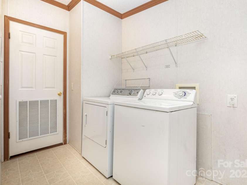 611 Robinson Street, Dallas, NC 28034.  MLS# CAR4261429, YatesRealty ID 24747. Laundry / Utility room has so much room - you could add more storage and there is even a closet!