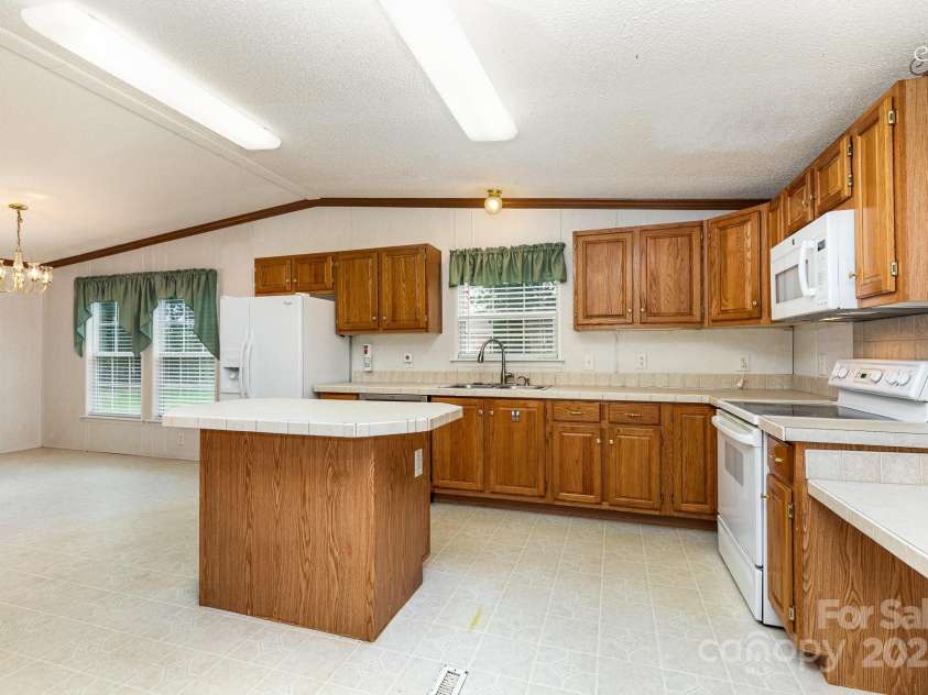 611 Robinson Street, Dallas, NC 28034.  MLS# CAR4261429, YatesRealty ID 24747. This home has a very large kitchen with center island - and includes all appliances.