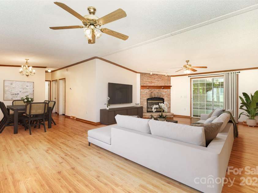 611 Robinson Street, Dallas, NC 28034.  MLS# CAR4261429, YatesRealty ID 24747. Virtually Staged to show large open living and dining areas! Sliding door leads to screened porch.