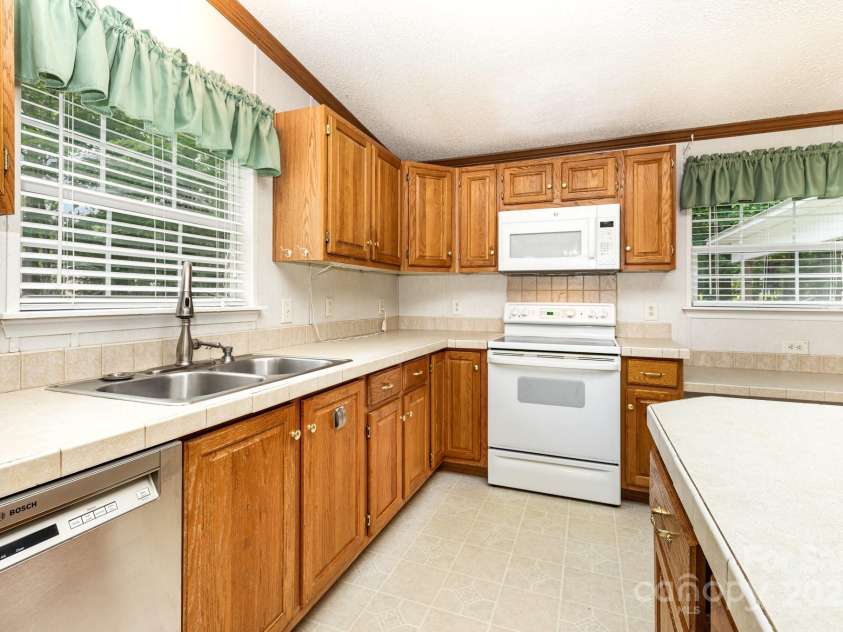 611 Robinson Street, Dallas, NC 28034.  MLS# CAR4261429, YatesRealty ID 24747. Window over the kitchen sink!  Also includes a meal planning desk a perfect spot to organize the mail.