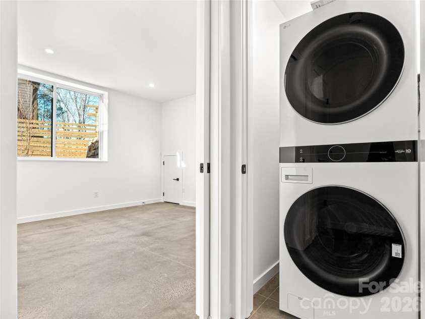 171 Houston Place, Asheville, NC 28801.  MLS# CAR4335456, YatesRealty ID 24763. Lower Level Laundry