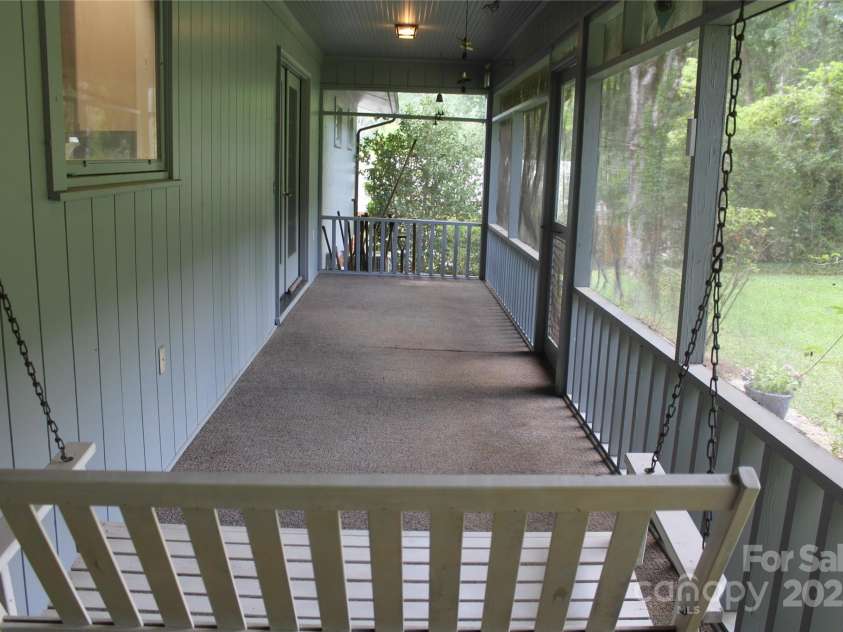 304 Terrace Place, Morganton, NC 28655.  MLS# CAR4277484, YatesRealty ID 24763. Screened porch swing view