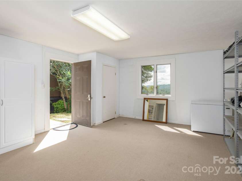 140 Bent Tree Drive, Hendersonville, NC 28739.  MLS# CAR4276557, YatesRealty ID 24764. Downstains bonus room and storage w/ view
