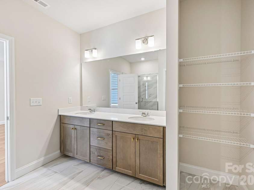 605 Banter Lane, Cramerton, NC 28032.  MLS# CAR4374152, YatesRealty ID 24768. Primary bathroom