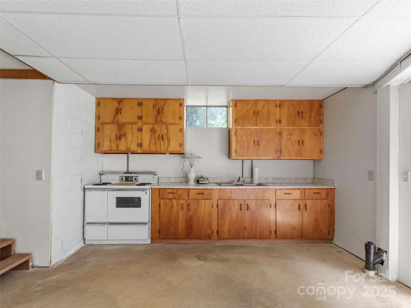 145 Appalachian Drive, Burnsville, NC 28714.  MLS# CAR4164720, YatesRealty ID 2477. Canning kitchen in basement