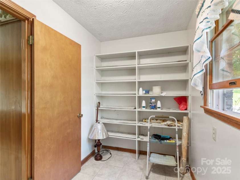 145 Appalachian Drive, Burnsville, NC 28714.  MLS# CAR4164720, YatesRealty ID 2477. Pantry adjacent to kitchen