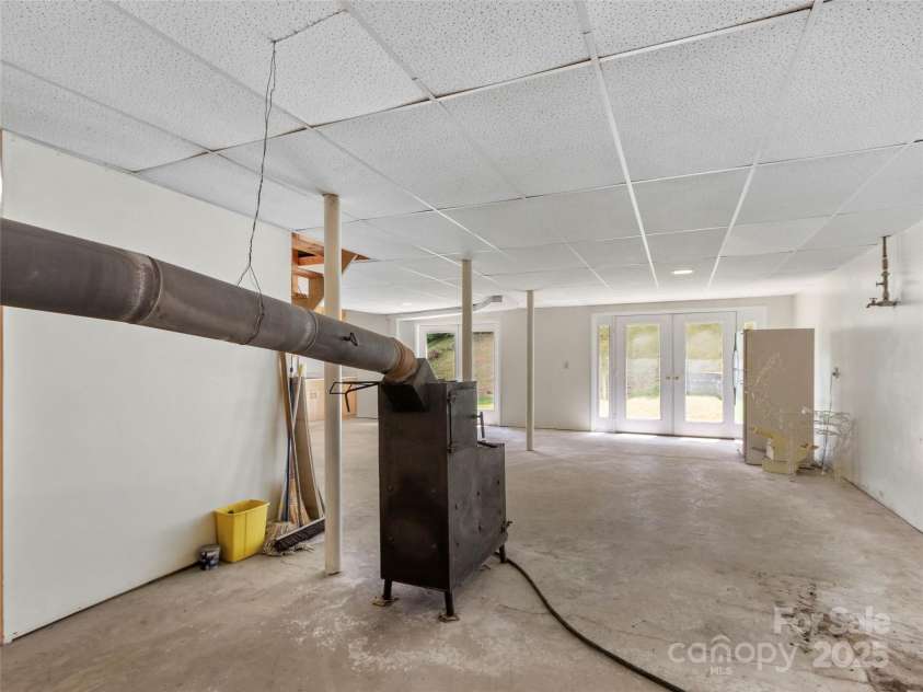 145 Appalachian Drive, Burnsville, NC 28714.  MLS# CAR4164720, YatesRealty ID 2477. Wood burning stove