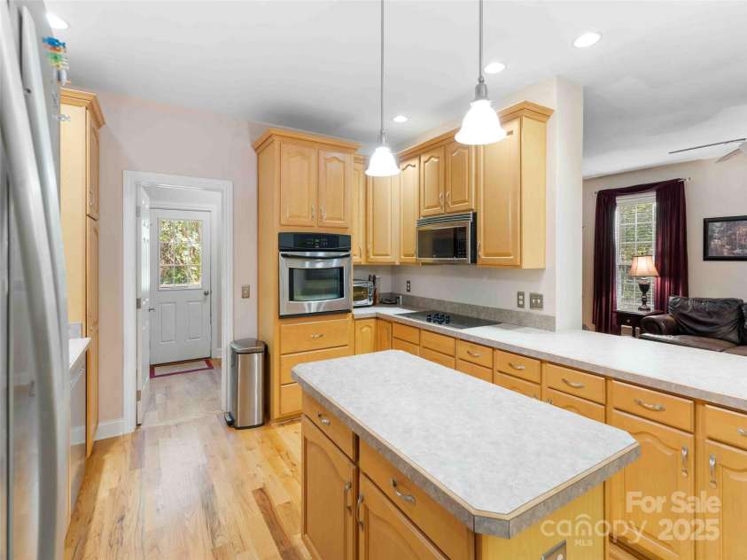 37 C Creek Lane, Pisgah Forest, NC 28768.  MLS# CAR4314709, YatesRealty ID 2477. Bright kitchen with ample cabinetry and workspace for daily living and entertaining.