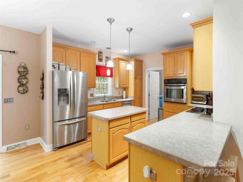 37 C Creek Lane, Pisgah Forest, NC 28768.  MLS# CAR4314709, YatesRealty ID 2477. Bright kitchen with ample cabinetry and workspace for daily living and entertaining.