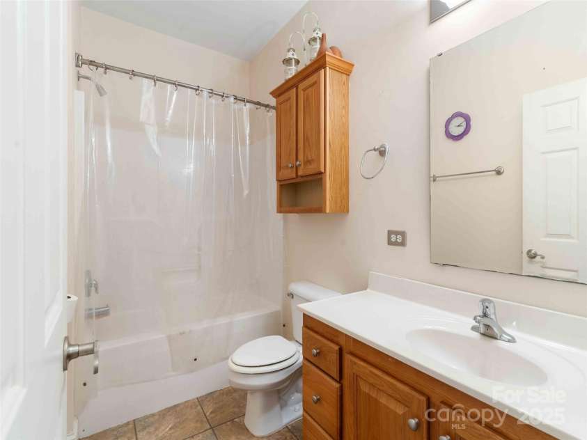 37 C Creek Lane, Pisgah Forest, NC 28768.  MLS# CAR4314709, YatesRealty ID 2477. Full guest bath with classic finishes.