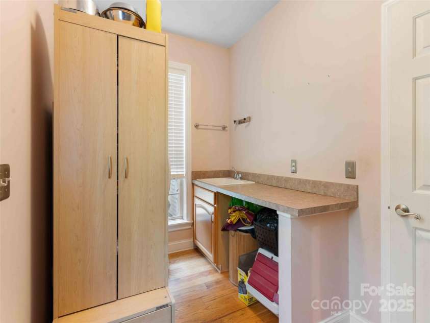 37 C Creek Lane, Pisgah Forest, NC 28768.  MLS# CAR4314709, YatesRealty ID 2477. Functional utility room with added storage