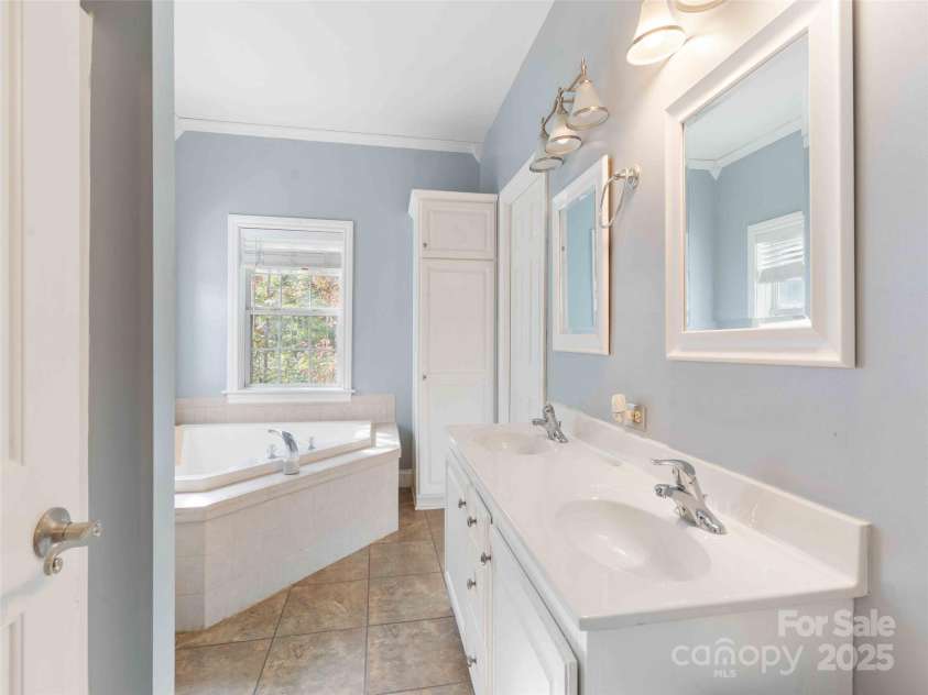 37 C Creek Lane, Pisgah Forest, NC 28768.  MLS# CAR4314709, YatesRealty ID 2477. Private primary bath with a clean, functional layout