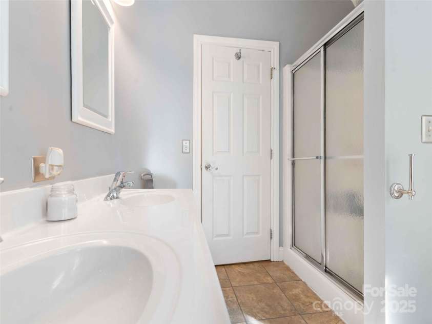 37 C Creek Lane, Pisgah Forest, NC 28768.  MLS# CAR4314709, YatesRealty ID 2477. Private primary bath with a clean, functional layout