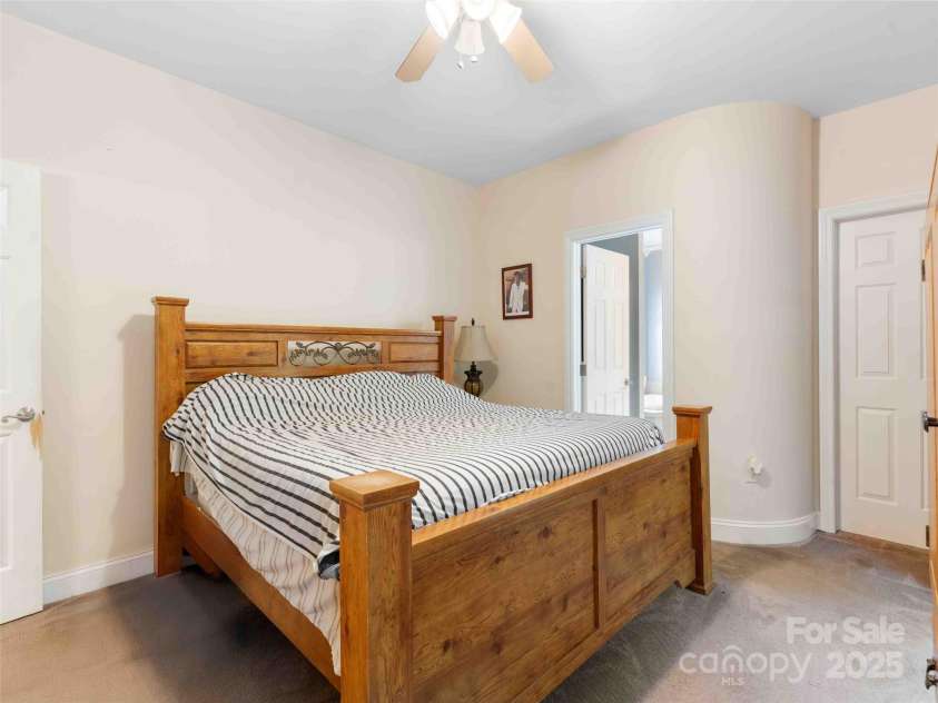 37 C Creek Lane, Pisgah Forest, NC 28768.  MLS# CAR4314709, YatesRealty ID 2477. Spacious primary bedroom designed for rest and comfort.