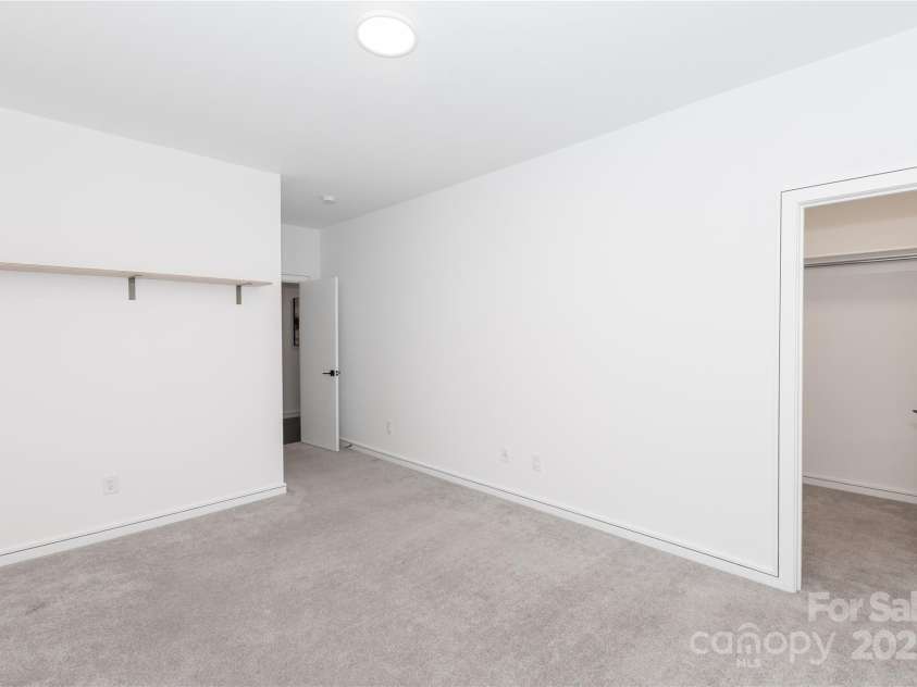 2107 Trade Street, Charlotte, NC 28216.  MLS# CAR4271767, YatesRealty ID 24789. Second Bedroom with Walk-In Closet