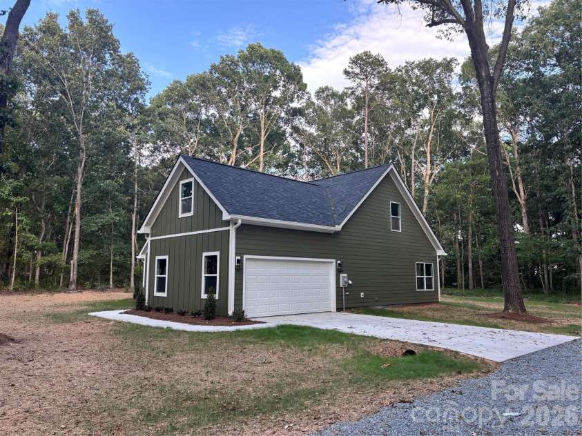1818 New Salem Road, Monroe, NC 28110.  MLS# CAR4382625, YatesRealty ID 24797. Garage side