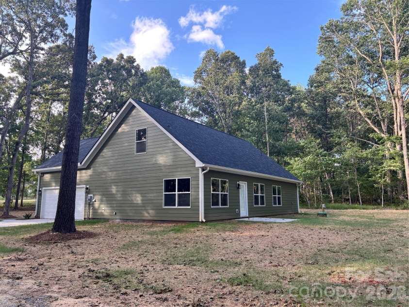 1818 New Salem Road, Monroe, NC 28110.  MLS# CAR4382625, YatesRealty ID 24797. Garage side/back