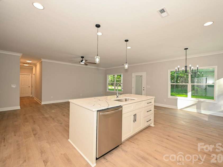 1818 New Salem Road, Monroe, NC 28110.  MLS# CAR4382625, YatesRealty ID 24797. Kitchen and living