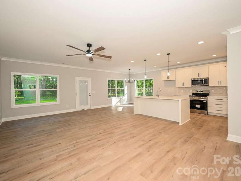 1818 New Salem Road, Monroe, NC 28110.  MLS# CAR4382625, YatesRealty ID 24797. Living room & kitchen