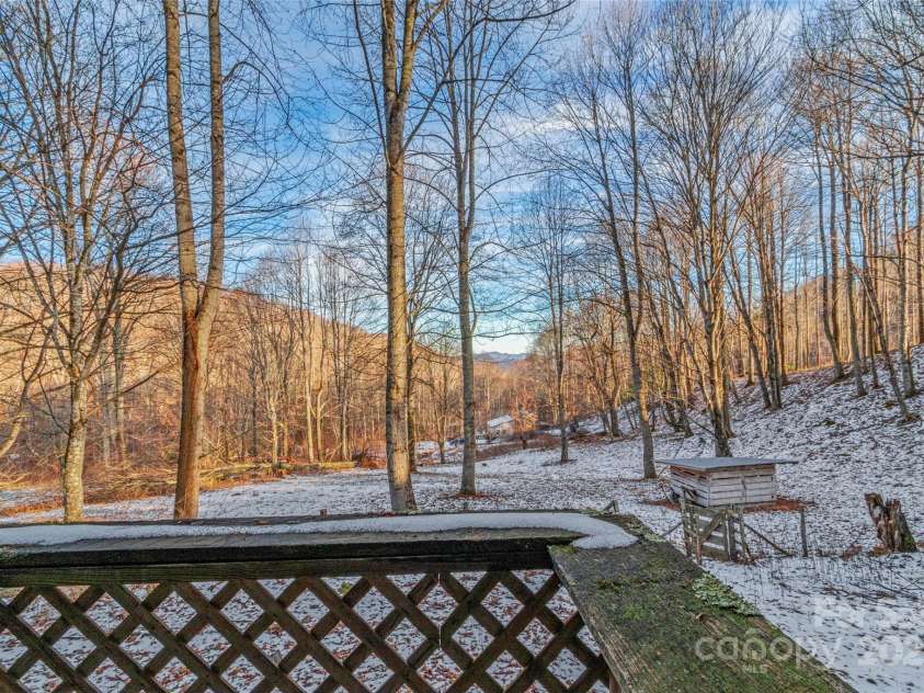 1571 Roaring Fork Road, Burnsville, NC 28714.  MLS# CAR4309867, YatesRealty ID 2480. Balcony off back enclosed porch