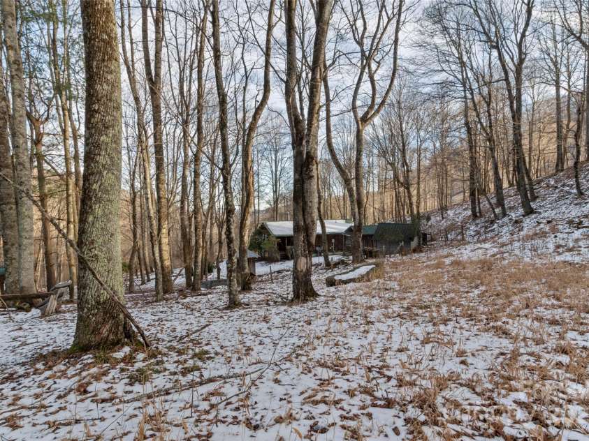 1571 Roaring Fork Road, Burnsville, NC 28714.  MLS# CAR4309867, YatesRealty ID 2480. View of house from upper field