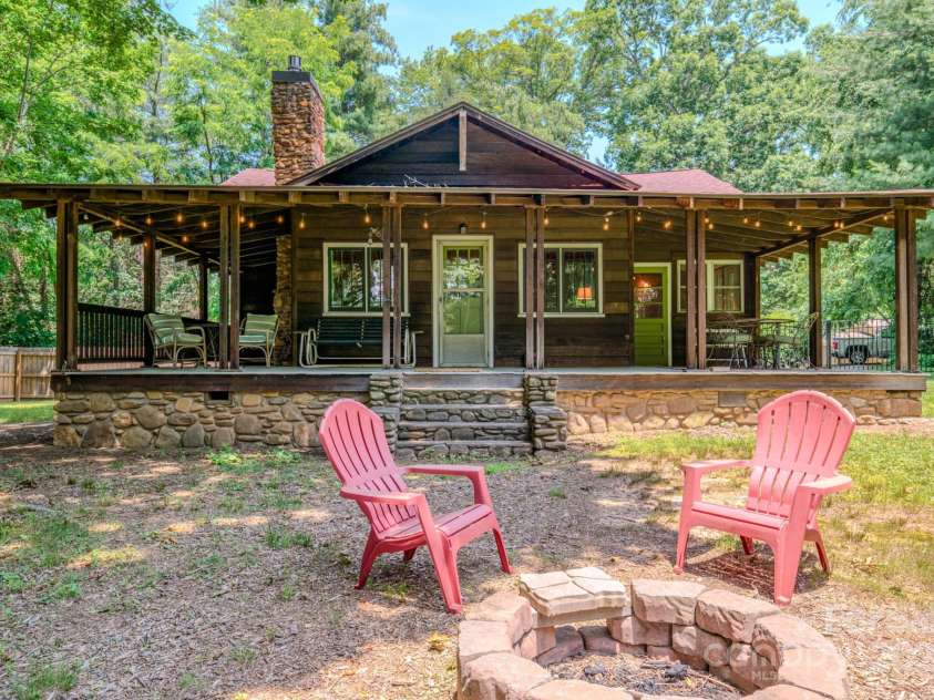 7 Bachelder Lane, Candler, NC 28715.  MLS# CAR4271857, YatesRealty ID 24801. Expansive, wrap around porch and fire pit