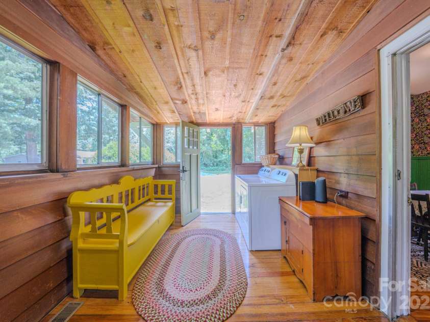 7 Bachelder Lane, Candler, NC 28715.  MLS# CAR4271857, YatesRealty ID 24801. Large laundry room with entry door
