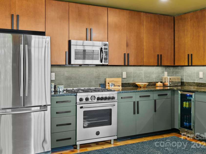 100 Coxe Avenue, Asheville, NC 28801.  MLS# CAR4271737, YatesRealty ID 24809. Kitchen corner shot