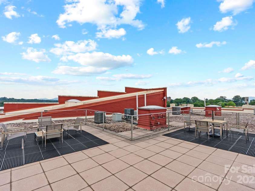 100 Coxe Avenue, Asheville, NC 28801.  MLS# CAR4271737, YatesRealty ID 24809. Rooftop facing south west
