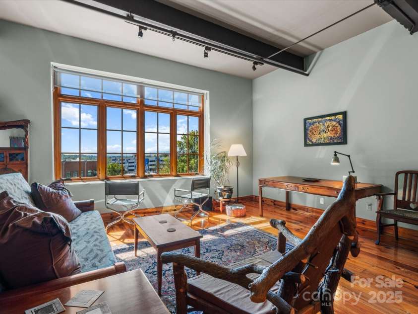 100 Coxe Avenue, Asheville, NC 28801.  MLS# CAR4307768, YatesRealty ID 24809. Abundant natural light from large casement windows