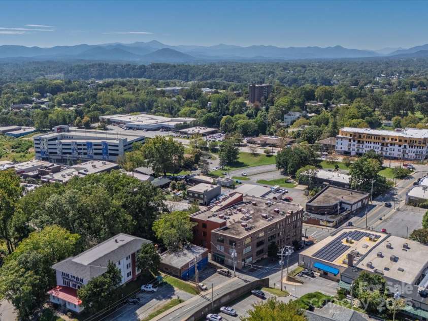 100 Coxe Avenue, Asheville, NC 28801.  MLS# CAR4307768, YatesRealty ID 24809. Convenient downtown access with easy connections to major routes and nearby parks