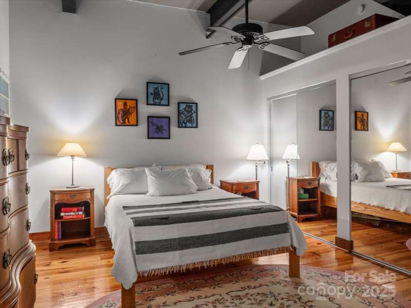 100 Coxe Avenue, Asheville, NC 28801.  MLS# CAR4307768, YatesRealty ID 24809. Door to bathroom from the primary bedroom