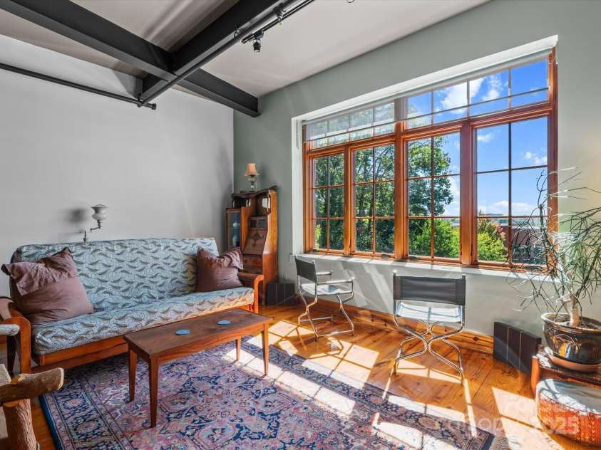 100 Coxe Avenue, Asheville, NC 28801.  MLS# CAR4307768, YatesRealty ID 24809. Flexible, bright living space