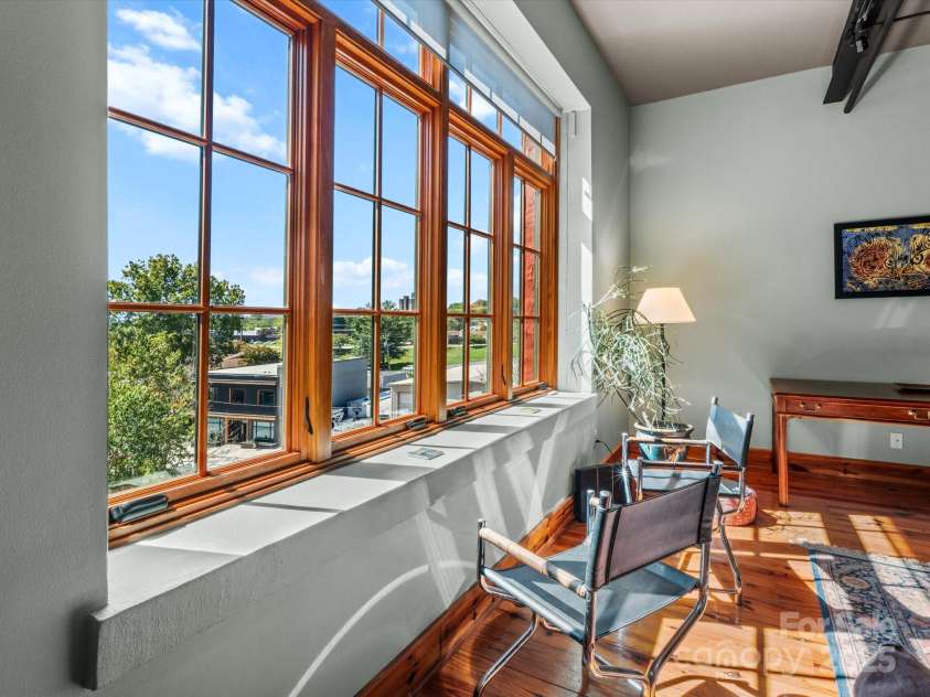 100 Coxe Avenue, Asheville, NC 28801.  MLS# CAR4307768, YatesRealty ID 24809. Mountain views visible from the comfort of your living room