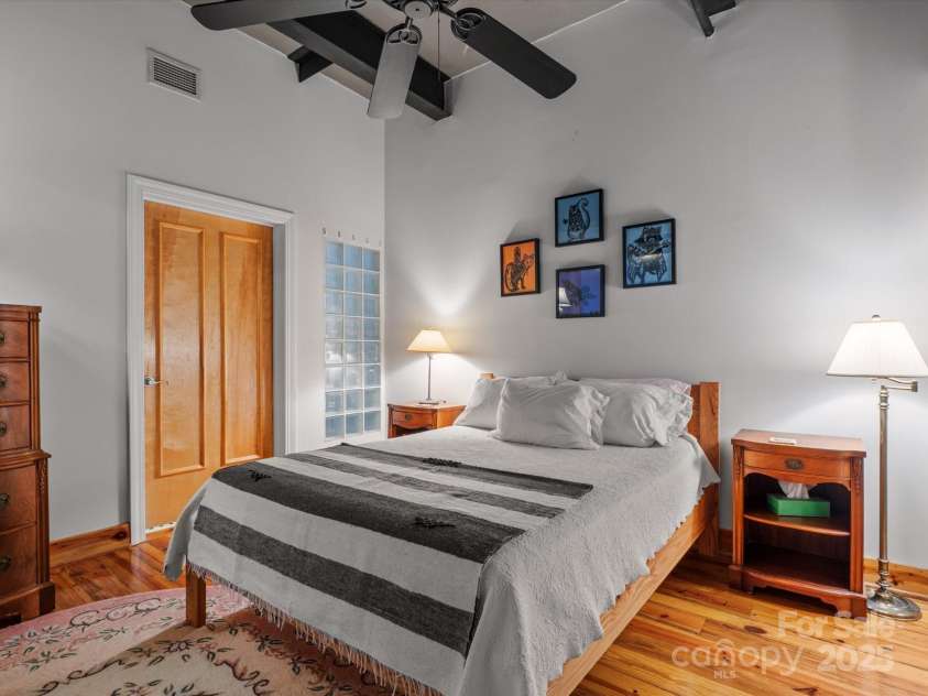 100 Coxe Avenue, Asheville, NC 28801.  MLS# CAR4307768, YatesRealty ID 24809. Private primary bedroom with generous closet space