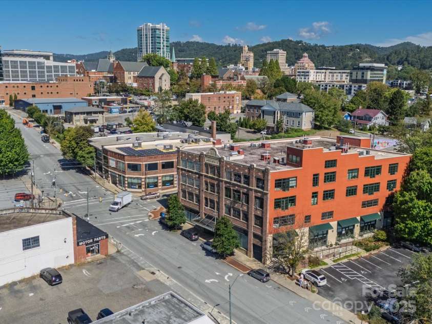 100 Coxe Avenue, Asheville, NC 28801.  MLS# CAR4307768, YatesRealty ID 24809. The iconic Sawyer Motor Building, a historic downtown Asheville landmark