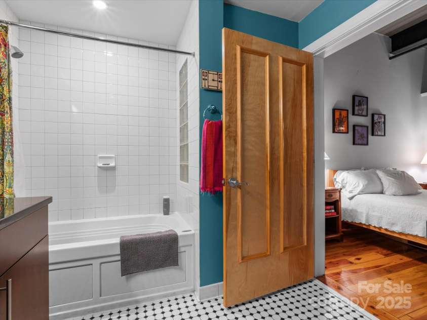 100 Coxe Avenue, Asheville, NC 28801.  MLS# CAR4307768, YatesRealty ID 24809. View from the bedroom into the bathroom