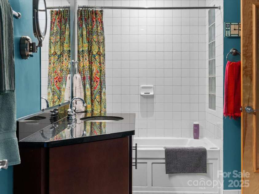 100 Coxe Avenue, Asheville, NC 28801.  MLS# CAR4307768, YatesRealty ID 24809. Well-maintained and thoughtfully appointed bath space