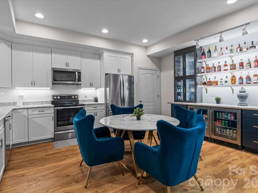111 Abbeville Lane, Mooresville, NC 28117.  MLS# CAR4368339, YatesRealty ID 24809. Basement Kitchen with Bar