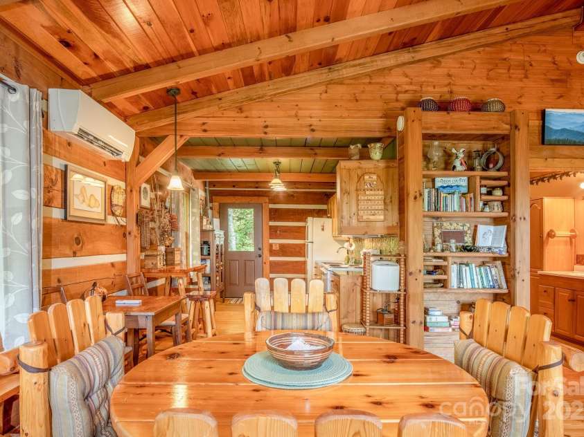 55 Bearwallow Road, Leicester, NC 28748.  MLS# CAR4278949, YatesRealty ID 24812. Dining into Kitchen