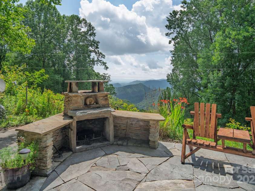 55 Bearwallow Road, Leicester, NC 28748.  MLS# CAR4278949, YatesRealty ID 24812. Outdoor Fireplace with Mountain Views